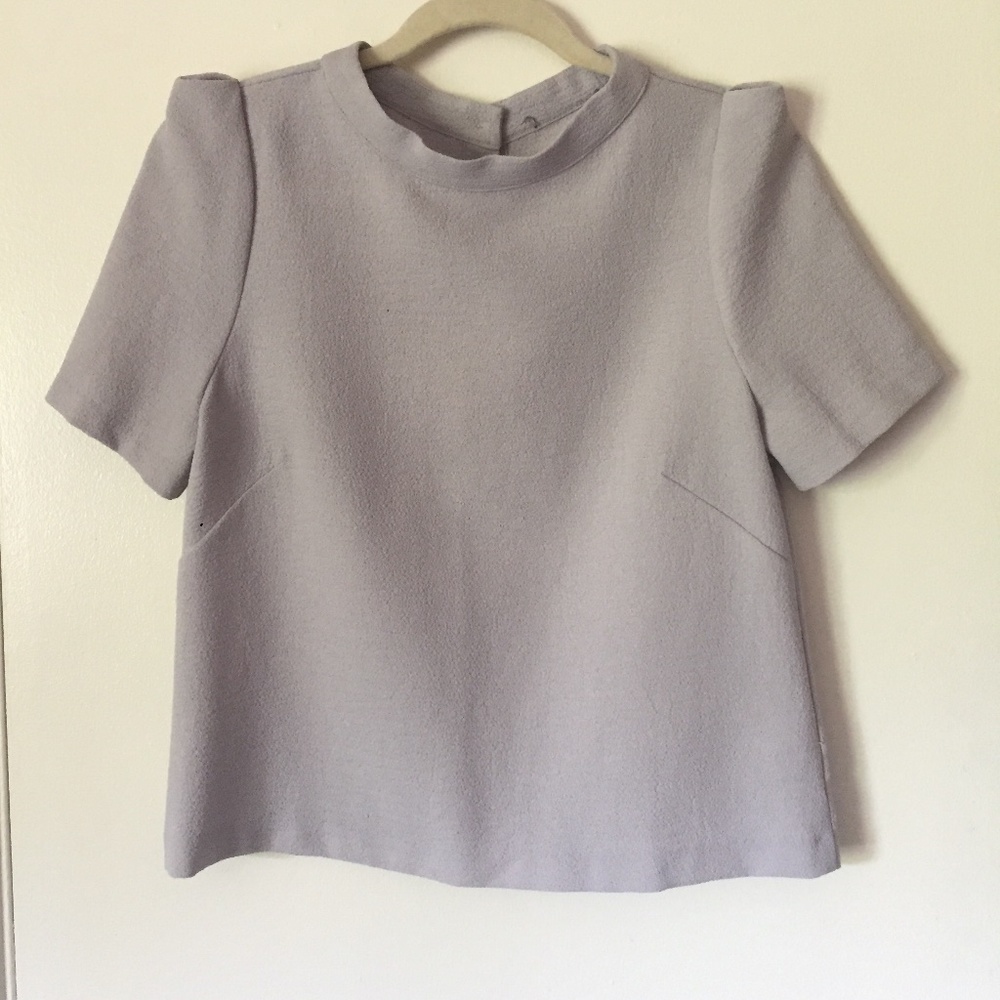 Puff sleeve blouse with button down closure in the back